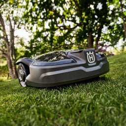 Robotic lawnmower on grass